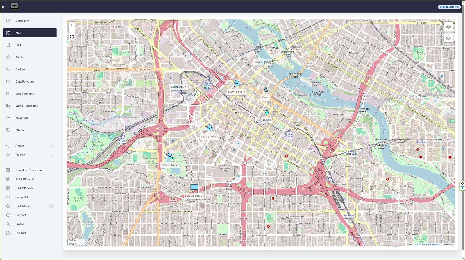 An OpenTAKServer map showing six live aircraft and ground vehicle tracks over a city, each labelled with its callsign and crew address.
